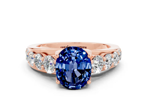 Rose gold Oval Cut Blue Sapphire Engagement Ring with Pavé Band and Four-Prong Setting