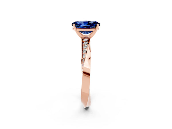 Rose gold Oval Cut Blue Sapphire Engagement Ring with Side Stone Accents and Four-Prong Setting