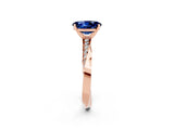 Rose gold Oval Cut Blue Sapphire Engagement Ring with Side Stone Accents and Four-Prong Setting_62