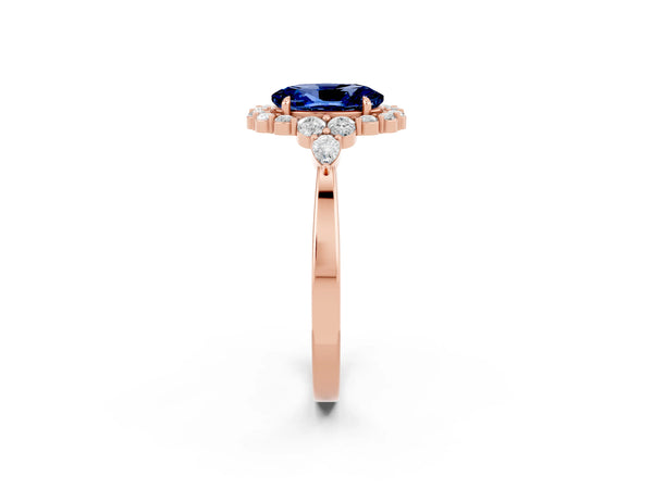 Rose gold Oval Cut Blue Sapphire Halo Ring with Pear Side Stones and Prong Setting