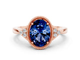 Rose gold Oval Cut Blue Sapphire Halo Ring with Tapered Band and Four-Prong Setting