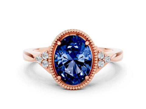 Rose gold Oval Cut Blue Sapphire Halo Ring with Tapered Band and Four-Prong Setting