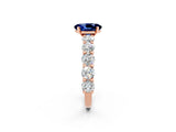 Rose gold Oval Cut Blue Sapphire Prong Setting with Side Stones on a Pave Band_2
