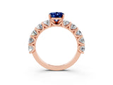 Rose gold Oval Cut Blue Sapphire Prong Setting with Side Stones on a Pave Band_3