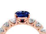 Rose gold Oval Cut Blue Sapphire Prong Setting with Side Stones on a Pave Band_4