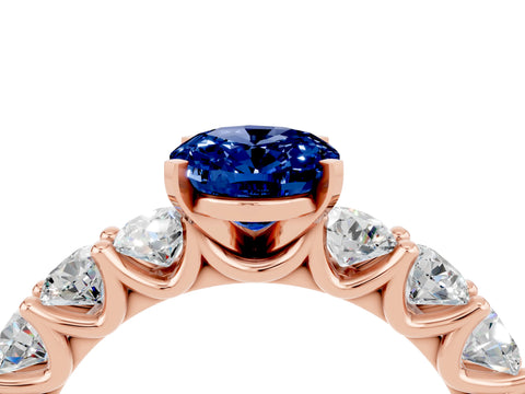 Rose gold Oval Cut Blue Sapphire Prong Setting with Side Stones on a Pave Band_4