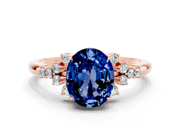 Rose gold Oval Cut Blue Sapphire Ring with Side Stones and Four-Prong Setting