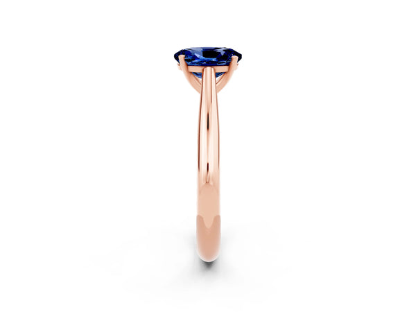 Rose gold Oval Cut Blue Sapphire Solitaire Engagement Ring with Cathedral Setting and Four-Prong Mount