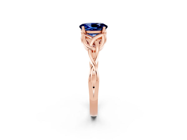 Rose gold Oval Cut Blue Sapphire Solitaire Engagement Ring with Celtic Knot Band and Four-Prong Setting