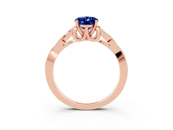 Rose gold Oval Cut Blue Sapphire Solitaire Engagement Ring with Celtic Knot Band and Four-Prong Setting