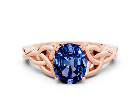 Rose gold Oval Cut Blue Sapphire Solitaire Engagement Ring with Celtic Knot Band and Four-Prong Setting