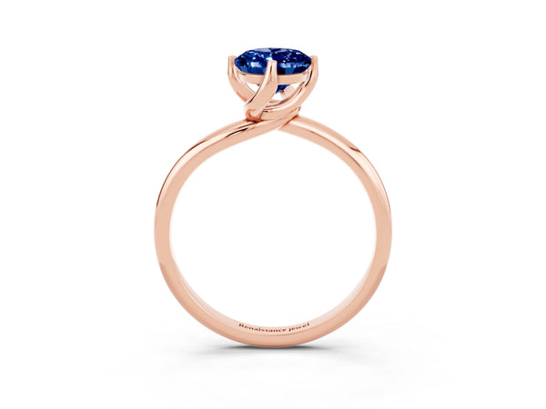 Rose gold Oval Cut Blue Sapphire Solitaire Engagement Ring with Four-Prong Setting and Classic Band