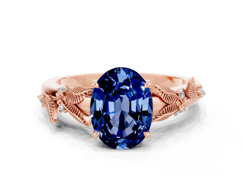 Rose gold Oval Cut Blue Sapphire Solitaire Ring with Leaf Motif Band and Four-Prong Setting