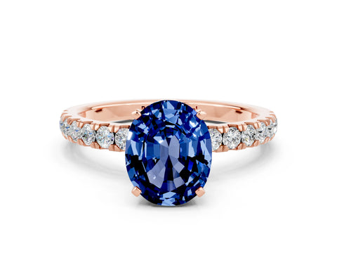 Rose gold Oval Cut Blue Sapphire Solitaire Ring with Pavé Accents and Four-Prong Setting