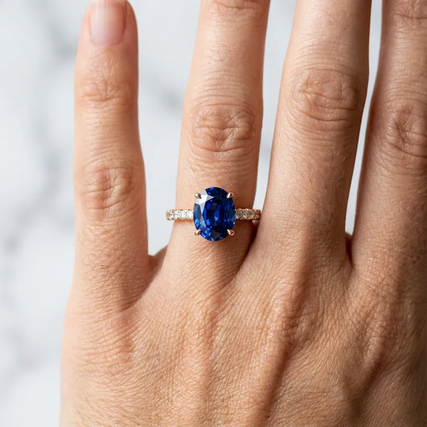 Rose gold Oval Cut Blue Sapphire Solitaire Ring with Round  Pavé Band and Four-Prong Setting