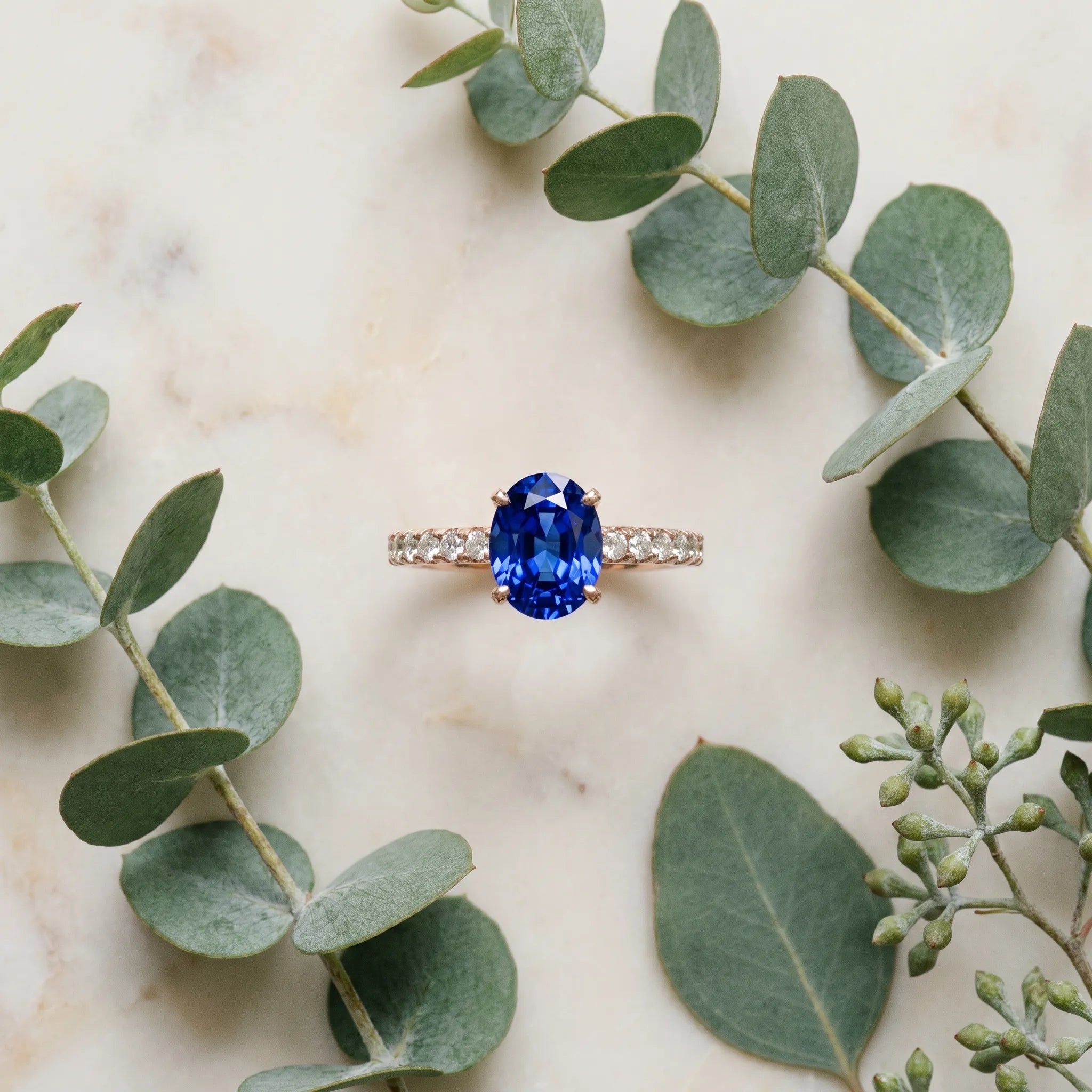 Rose gold Oval Cut Blue Sapphire Solitaire Ring with Round  Pavé Band and Four-Prong Setting_45