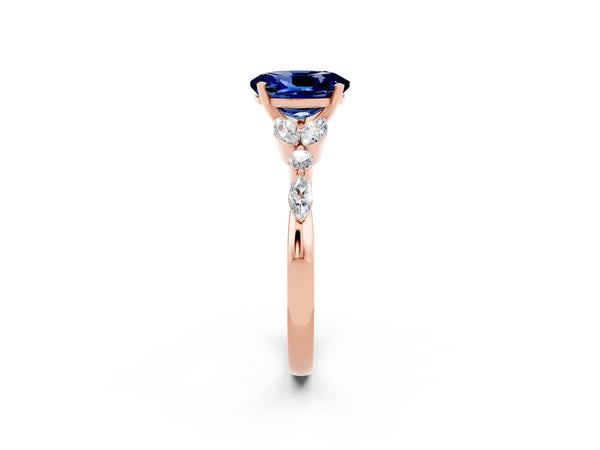 Rose gold Oval Cut Blue Sapphire Solitaire Ring with Side Stones and Four-Prong Setting