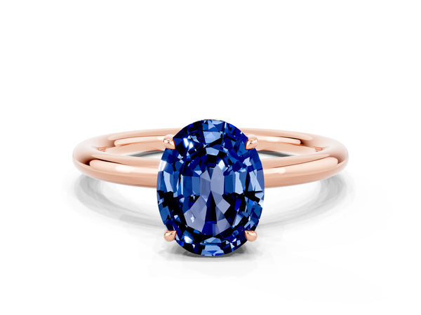 Rose gold Oval Cut Blue Sapphire Solitaire Ring with Thin Band and Four-Prong Setting