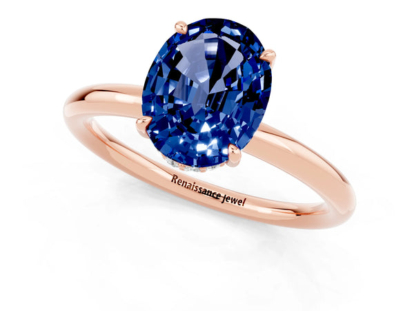 Rose gold Oval Cut Blue Sapphire Solitaire Ring with Thin Band and Four-Prong Setting