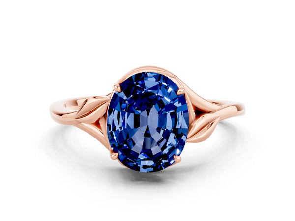 Rose gold Oval Cut Blue Sapphire Solitaire Ring with Twist Band and Four-Prong Setting
