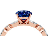 Rose gold Oval Cut Blue Sapphire Solitaire with Side Stones on a Pavé Band and Four-Prong Setting_4