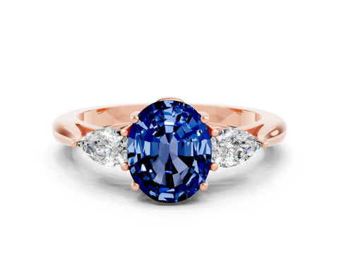 Rose gold Oval Cut Blue Sapphire Three-Stone Ring with Pear Side Stones and Four-Prong Setting_12