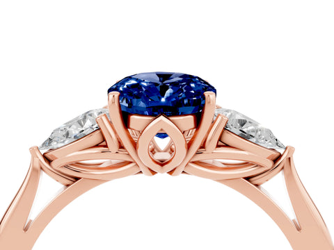 Rose gold Oval Cut Blue Sapphire Three-Stone Ring with Pear Side Stones and Four-Prong Setting_16