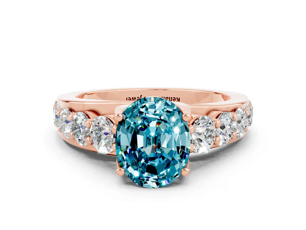 Rose gold Oval Cut Blue Topaz Engagement Ring with Pavé Band and Four-Prong Setting
