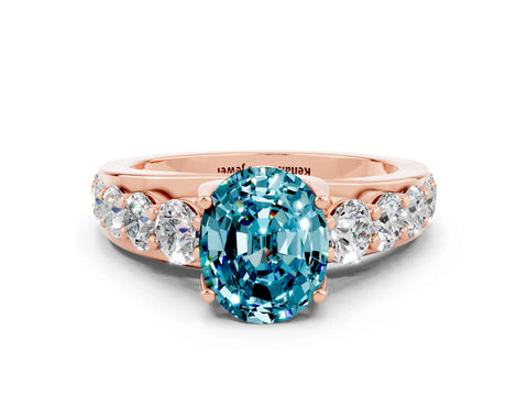 Rose gold Oval Cut Blue Topaz Engagement Ring with Pavé Band and Four-Prong Setting