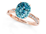 Rose gold Oval Cut Blue Topaz Engagement Ring with Side Stone Accents and Four-Prong Setting_61