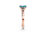 Rose gold Oval Cut Blue Topaz Engagement Ring with Side Stone Accents and Four-Prong Setting_62
