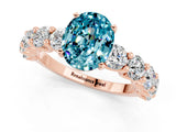 Rose gold Oval Cut Blue Topaz Prong Setting with Side Stones on a Pave Band_1