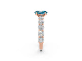 Rose gold Oval Cut Blue Topaz Prong Setting with Side Stones on a Pave Band_2