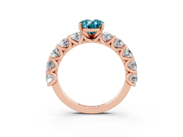 Rose gold Oval Cut Blue Topaz Prong Setting with Side Stones on a Pave Band