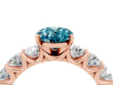 Rose gold Oval Cut Blue Topaz Prong Setting with Side Stones on a Pave Band_4