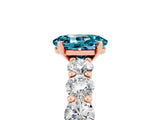 Rose gold Oval Cut Blue Topaz Prong Setting with Side Stones on a Pave Band_5