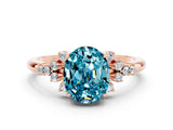 Rose gold Oval Cut Blue Topaz Ring with Side Stones and Four-Prong Setting_72
