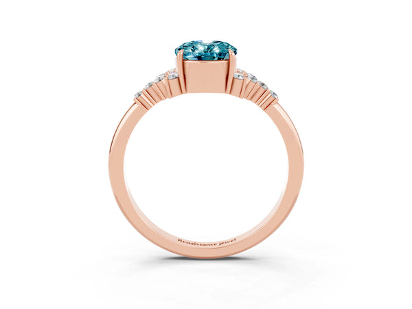 Rose gold Oval Cut Blue Topaz Ring with Side Stones and Four-Prong Setting