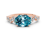 Rose gold Oval Cut Blue Topaz Scattered Round Accent Ring with Prong Setting_12