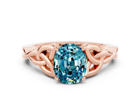 Rose gold Oval Cut Blue Topaz Solitaire Engagement Ring with Celtic Knot Band and Four-Prong Setting