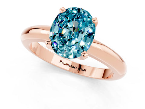Rose gold Oval Cut Blue Topaz Solitaire Engagement Ring with Round Band and Four-Prong Setting_1