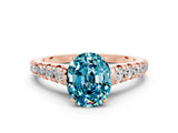 Rose gold Oval Cut Blue Topaz Solitaire Ring with Cathedral Setting and Pavé Band