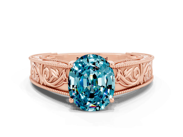 Rose gold Oval Cut Blue Topaz Solitaire Ring with Engraved Band and Four-Prong Setting