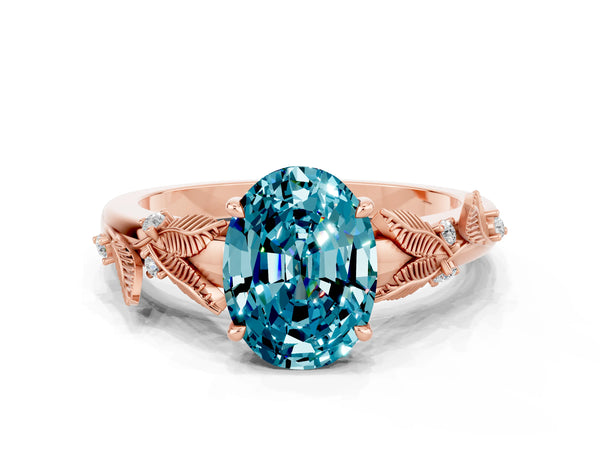 Rose gold Oval Cut Blue Topaz Solitaire Ring with Leaf Motif Band and Four-Prong Setting