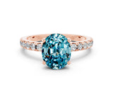 Rose gold Oval Cut Blue Topaz Solitaire Ring with Pavé Band and Four-Prong Setting_36