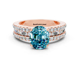 Rose gold Oval Cut Blue Topaz Solitaire Ring with Pavé and Channel Set Band