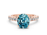 Rose gold Oval Cut Blue Topaz Solitaire Ring with Round  Pavé Band and Four-Prong Setting_44
