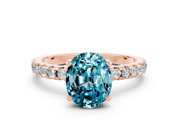 Rose gold Oval Cut Blue Topaz Solitaire Ring with Round Pavé Band and Four-Prong Setting