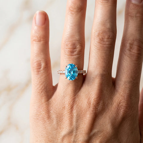 Rose gold Oval Cut Blue Topaz Solitaire Ring with Round  Pavé Band and Four-Prong Setting_54