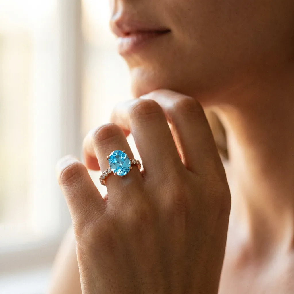 Rose gold Oval Cut Blue Topaz Solitaire Ring with Round  Pavé Band and Four-Prong Setting_56